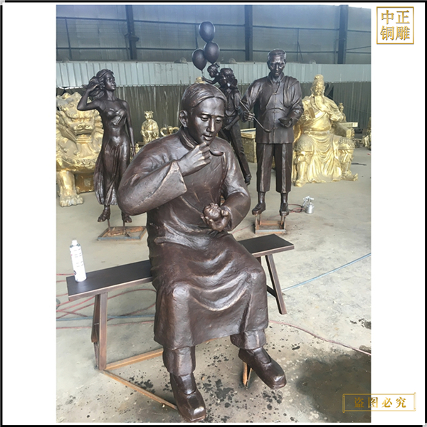 3吃包子人物銅雕塑.jpg