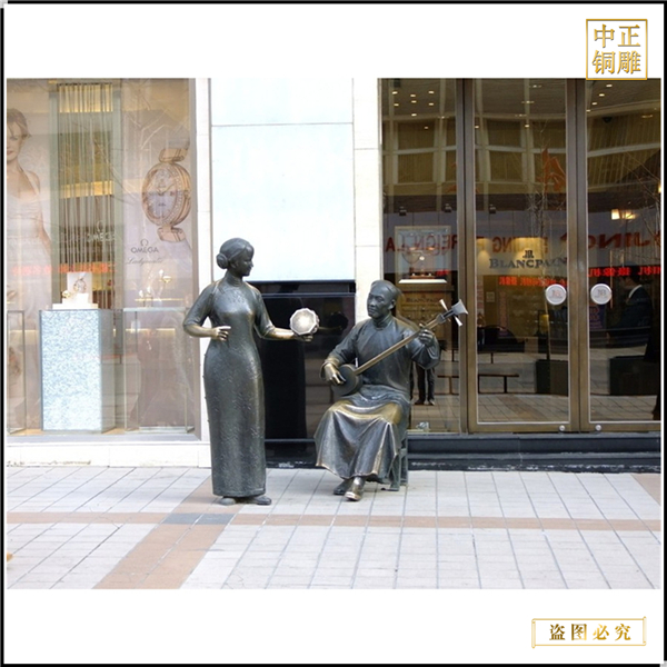 街邊彈唱古代人物雕塑